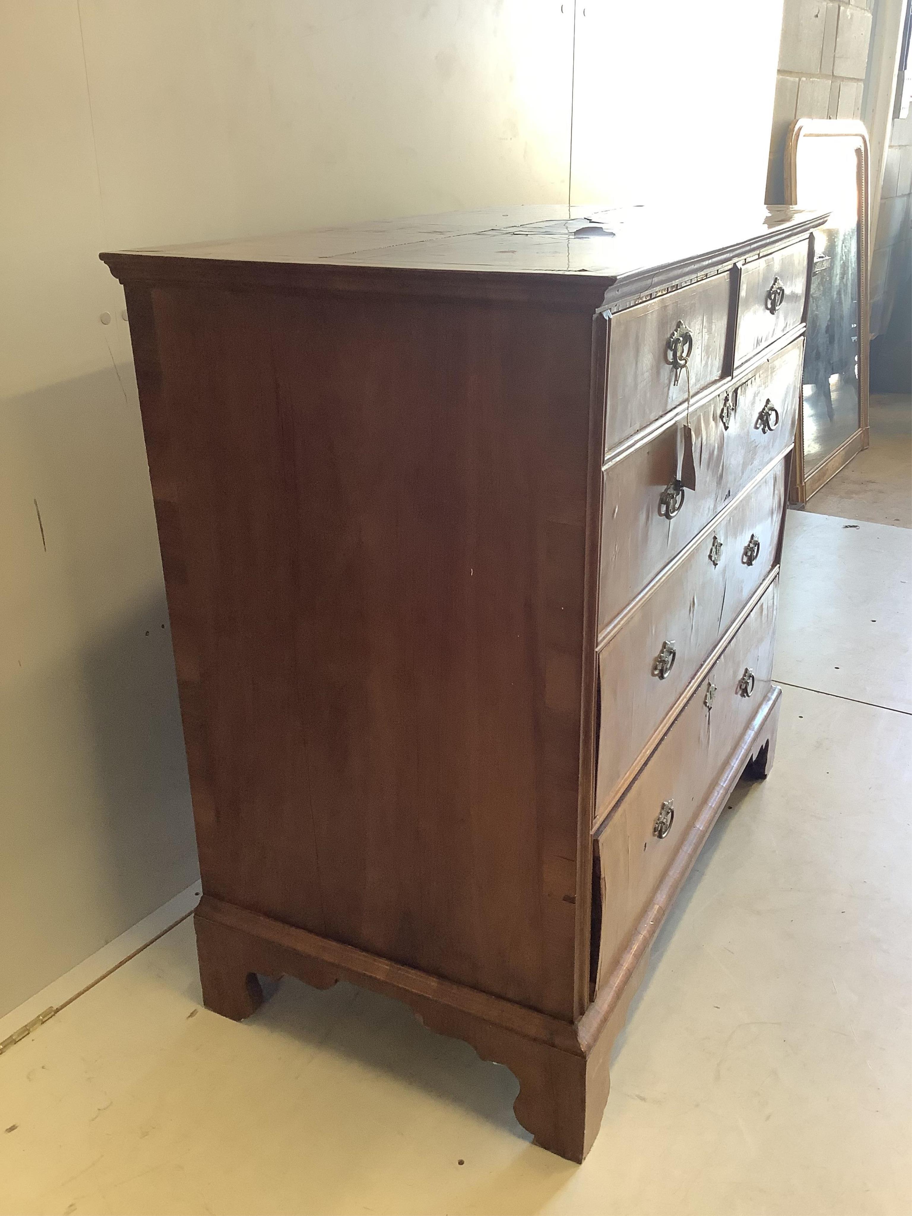 An 18th century and later banded walnut chest, width 101cm, depth 56cm, height 100cm. Condition - poor to fair